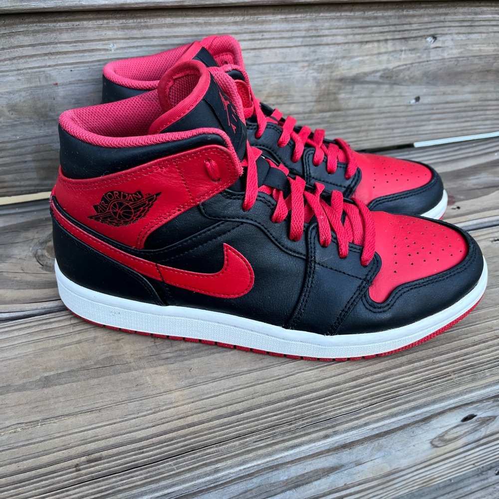 Nike Black and Red Mid-Top Sneakers with Iconic Design